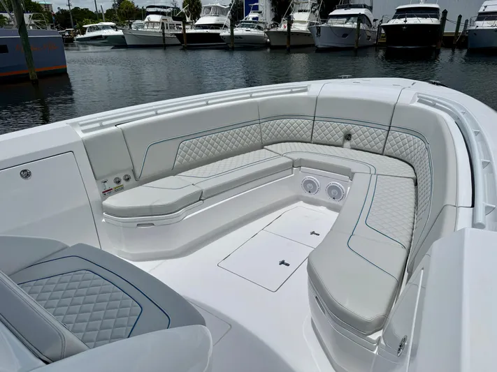  Yacht Photos Pics Luxurious seating area on 2025 Intrepid 345 Nomad FE boat, docked at marina.