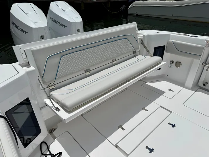  Yacht Photos Pics 2025 Intrepid 345 Nomad FE boat with foldable seating and dual Mercury engines.