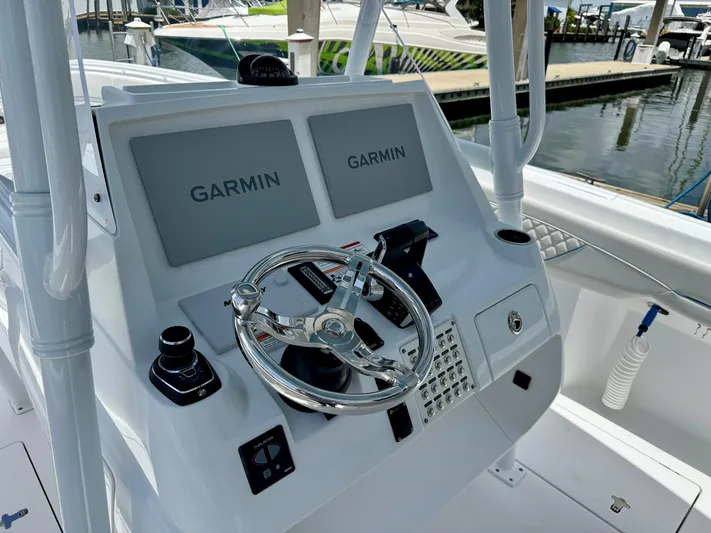  Yacht Photos Pics 2025 Intrepid 345 Nomad FE helm with dual Garmin displays and modern controls.