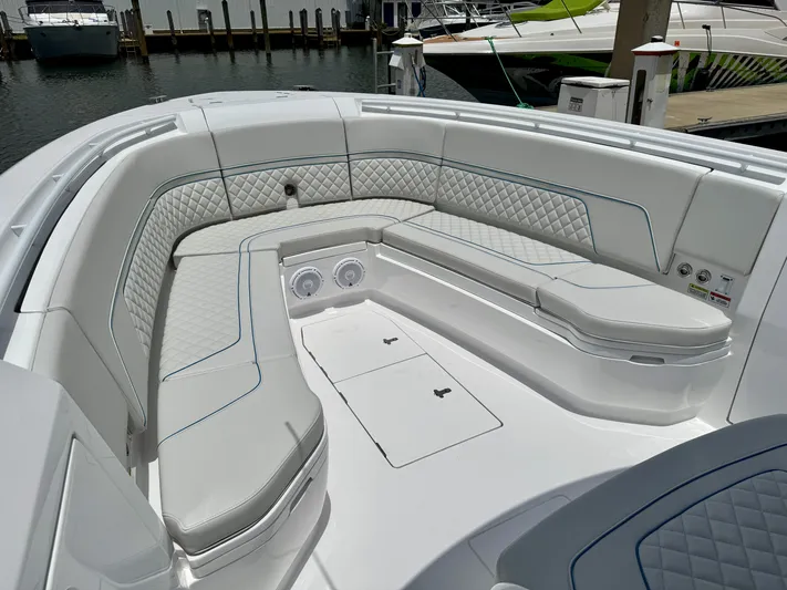  Yacht Photos Pics Luxurious seating area on 2025 Intrepid 345 Nomad FE boat, docked at marina.