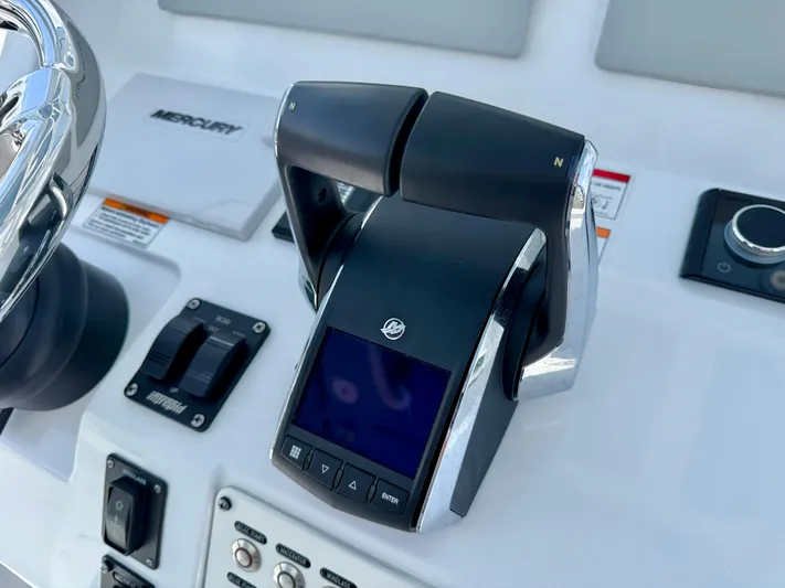  Yacht Photos Pics 2025 Intrepid 345 Nomad FE boat controls with Mercury throttle and switches.