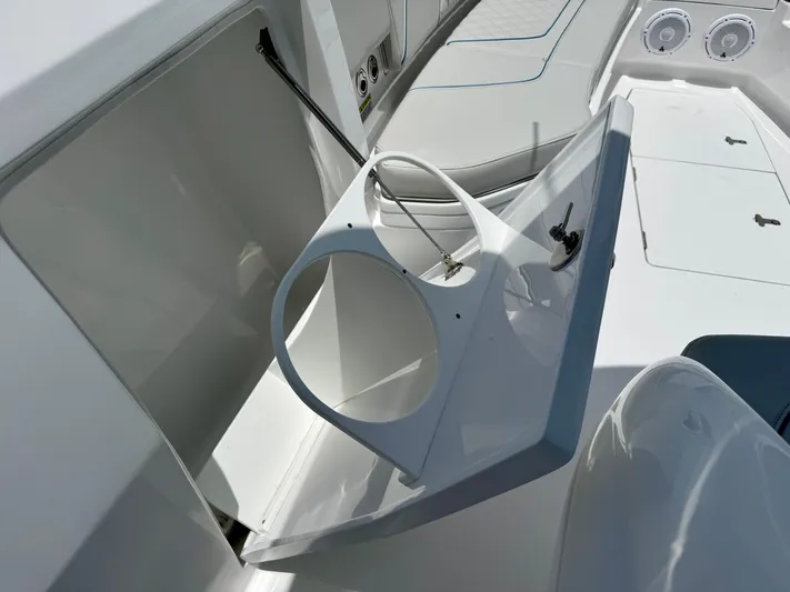  Yacht Photos Pics 2025 Intrepid 345 Nomad FE boat interior with open storage compartment and seating area.