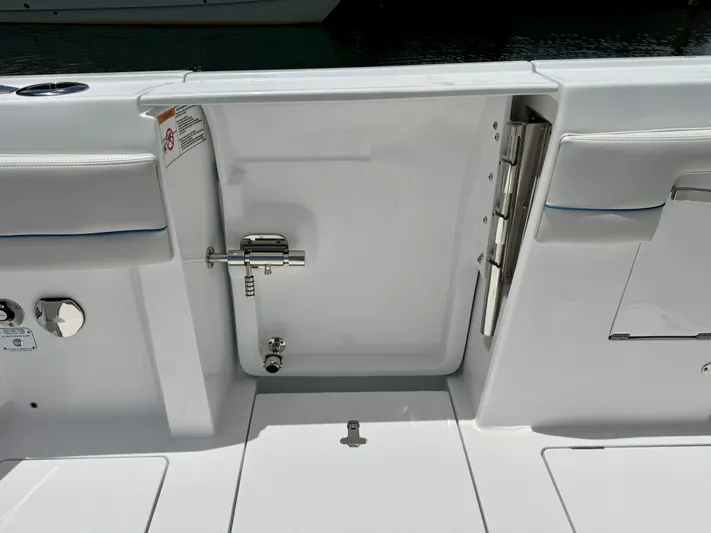  Yacht Photos Pics 2025 Intrepid 345 Nomad FE boat interior with sleek white finish and stainless steel fixtures.