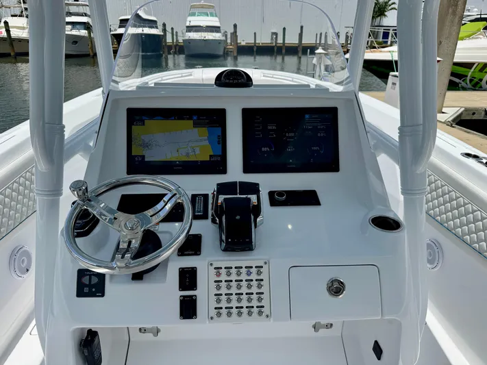  Yacht Photos Pics 2025 Intrepid 345 Nomad FE boat dashboard with navigation screens and controls.