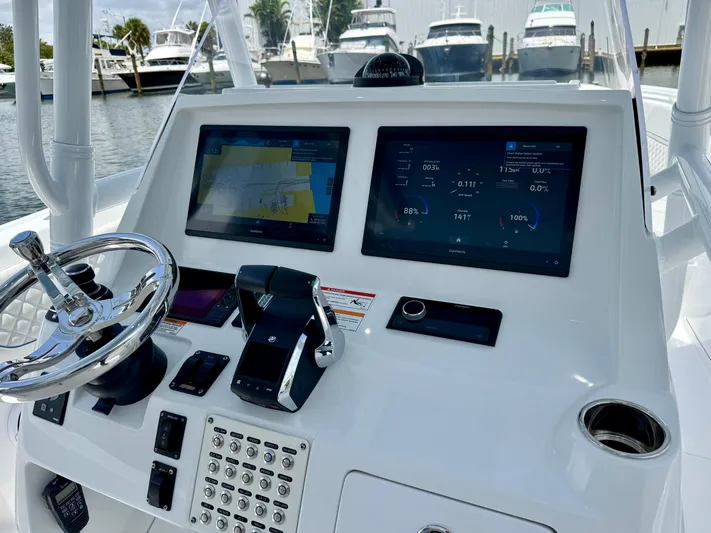  Yacht Photos Pics Helm of 2025 Intrepid 345 Nomad FE with dual Garmin displays and modern controls.