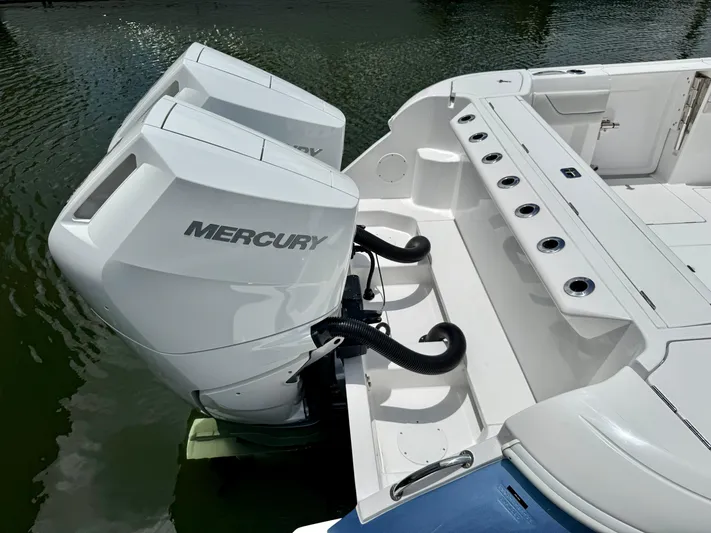  Yacht Photos Pics 2025 Intrepid 345 Nomad FE with dual Mercury outboard engines on water.