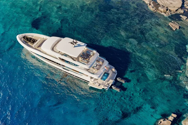 Moonen 133 Mallorca Yacht Photos Pics Aerial view of 2027 Moonen 133-Mallorca yacht in clear blue waters.