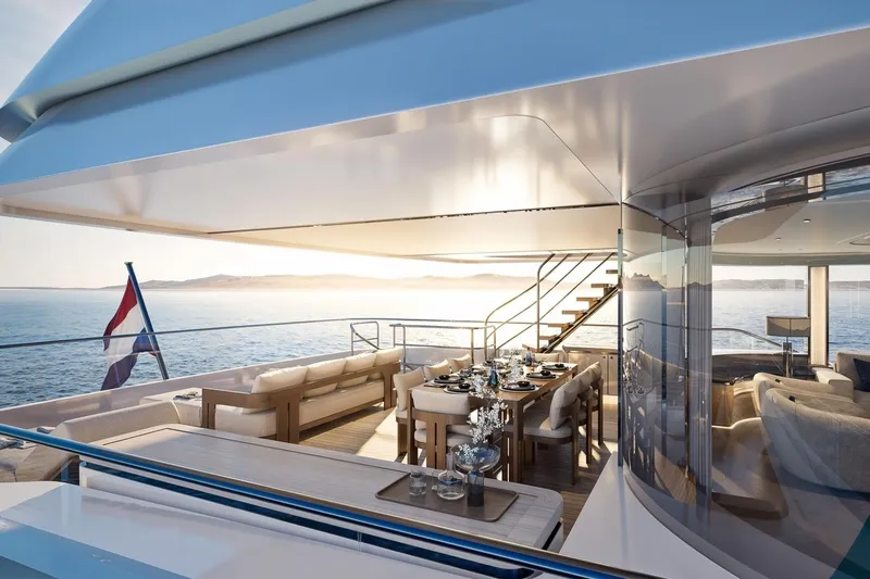 Moonen 133 Mallorca Yacht Photos Pics Luxurious 2027 Moonen 133-Mallorca yacht deck with elegant dining area at sunset.