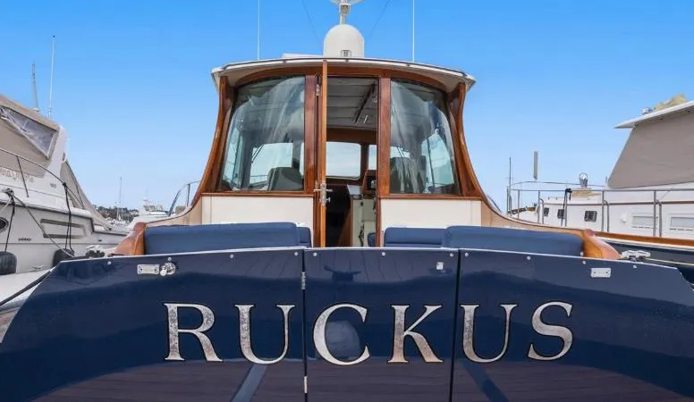 Ruckus Yacht Photos Pics Hinckley Talaria 44 MY 2009 yacht named "Ruckus" docked at a marina.