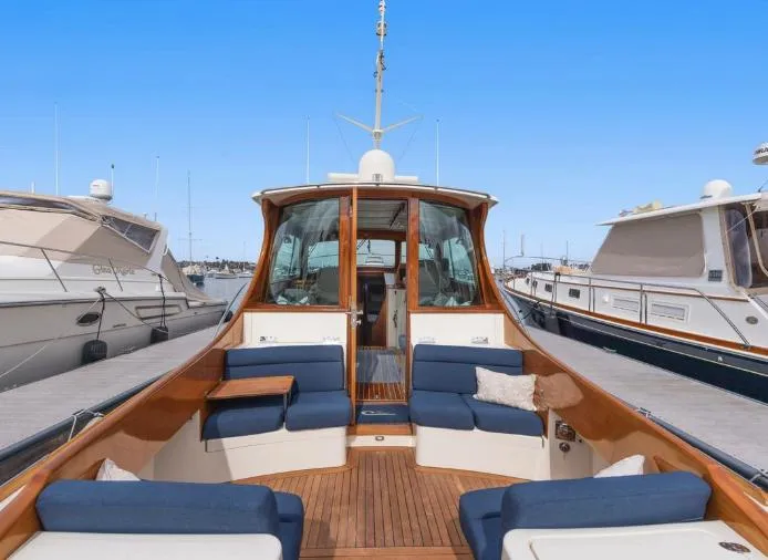 Ruckus Yacht Photos Pics 2009 Hinckley Talaria 44 MY yacht with elegant seating and wooden deck.