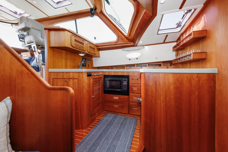 Ruckus Yacht Photos Pics Interior of 2009 Hinckley Talaria 44 MY yacht with wood cabinetry and modern amenities.