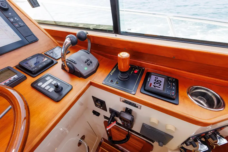 Ruckus Yacht Photos Pics Control panel of 2009 Hinckley Talaria 44 MY yacht with navigation instruments and throttle controls.