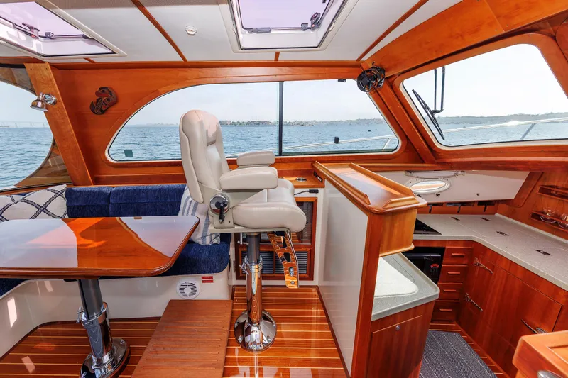 Ruckus Yacht Photos Pics Luxurious 2009 Hinckley Talaria 44 MY yacht interior with elegant wood finish and ocean view.