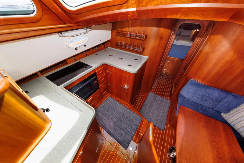 Ruckus Yacht Photos Pics Luxurious 2009 Hinckley Talaria 44 MY yacht interior with elegant wood finish and modern amenities.