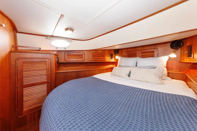 Ruckus Yacht Photos Pics Luxurious cabin interior of 2009 Hinckley Talaria 44 MY yacht with cozy bedding.