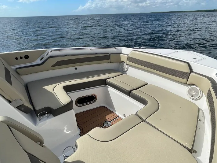 Lady B Yacht Photos Pics 2019 Pursuit 365 Dual Console boat with spacious seating on open water.