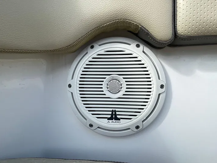 Lady B Yacht Photos Pics JL Audio speaker on 2019 Pursuit 365 Dual Console boat, near beige seating.