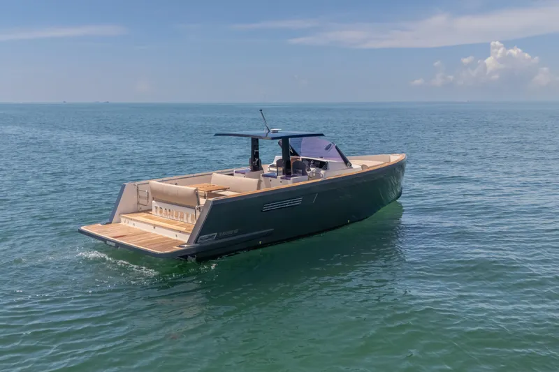 Tramonto Yacht Photos Pics 2021 Fjord 40 Open yacht cruising on calm ocean waters under a clear sky.