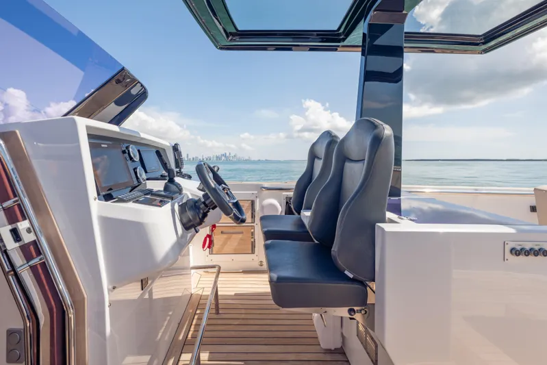 Tramonto Yacht Photos Pics 2021 Fjord 40 Open yacht cockpit with modern controls and ocean view.