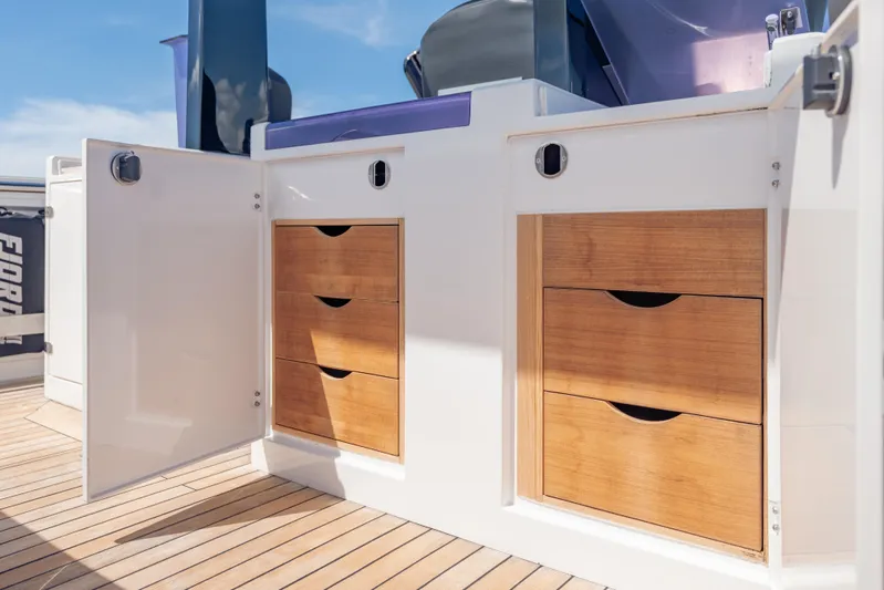 Tramonto Yacht Photos Pics Wooden storage drawers on a 2021 Fjord 40 Open yacht deck.