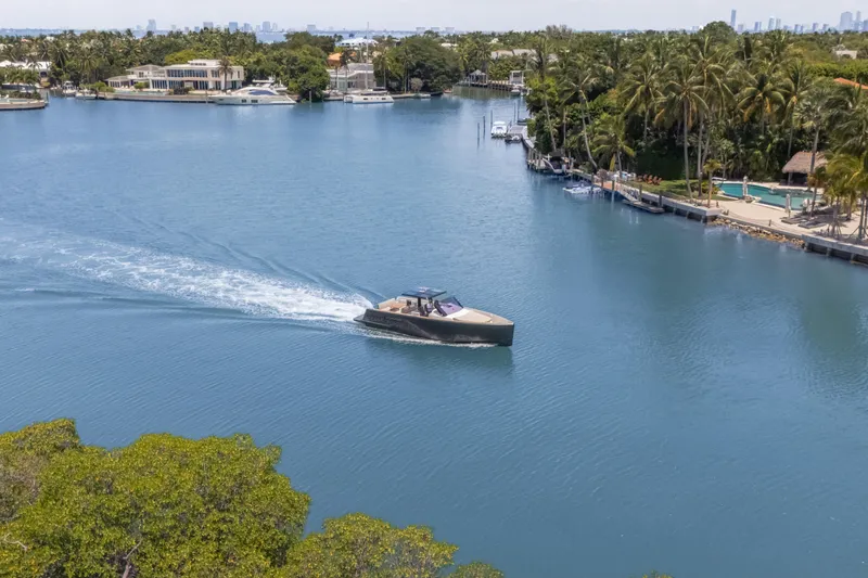 Tramonto Yacht Photos Pics 2021 Fjord 40 Open yacht cruising on a scenic, tropical waterway.