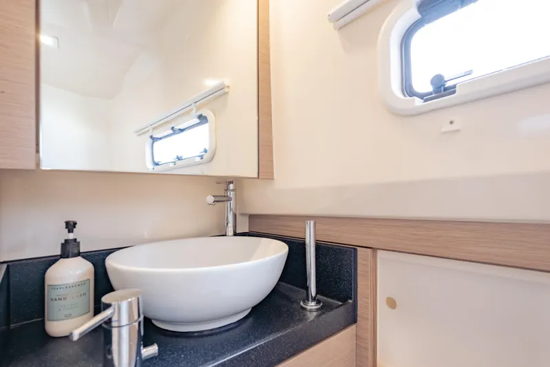 Tramonto Yacht Photos Pics Modern bathroom interior of 2021 Fjord 40 Open yacht with sleek sink and window.