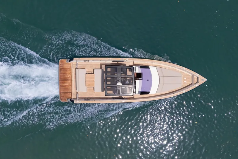 Tramonto Yacht Photos Pics Aerial view of 2021 Fjord 40 Open yacht cruising on water.