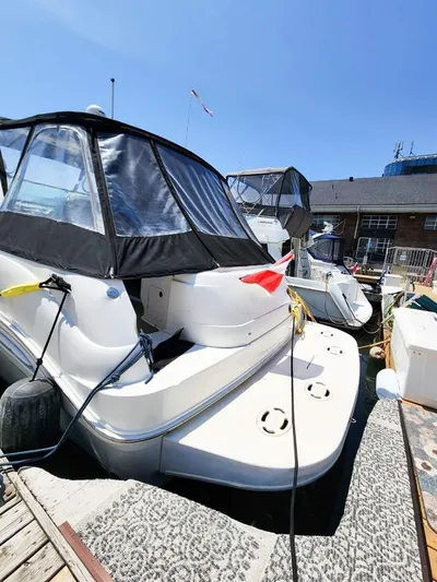  Yacht Photos Pics 1999 Sea Ray 460 Sundancer docked, featuring sleek design and covered cockpit.