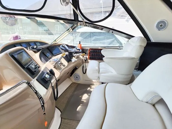  Yacht Photos Pics Interior of 1999 Sea Ray 460 Sundancer yacht with luxurious seating and modern controls.