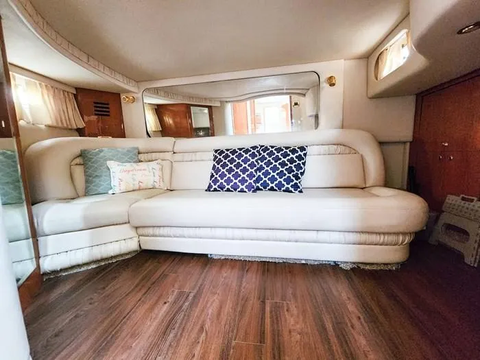 Yacht Photos Pics Luxurious interior of 1999 Sea Ray 460 Sundancer with plush seating and elegant decor.