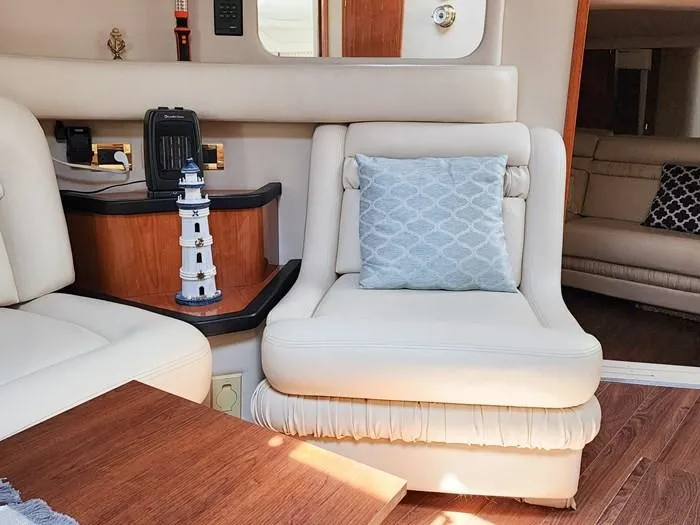  Yacht Photos Pics Luxurious interior of 1999 Sea Ray 460 Sundancer yacht with plush seating and decor.