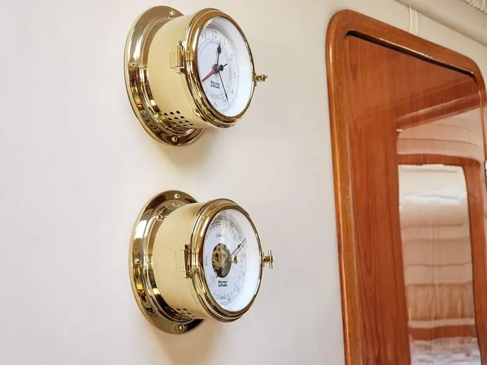  Yacht Photos Pics Gold nautical instruments on Sea Ray 460 Sundancer yacht, 1999 model, with wooden interior detail.