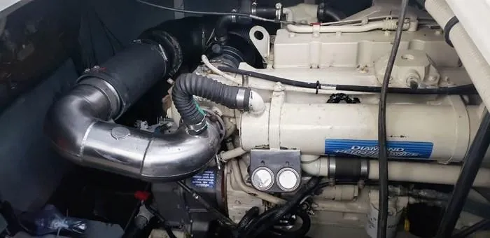  Yacht Photos Pics Engine compartment of a 1999 Sea Ray 460 Sundancer boat, showcasing mechanical components.