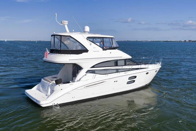  Yacht Photos Pics 2012 Meridian 441 Sedan yacht cruising on open water under clear skies.