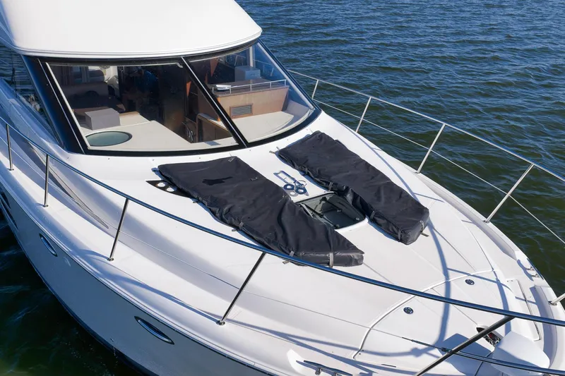  Yacht Photos Pics 2012 Meridian 441 Sedan yacht on water, featuring sleek design and spacious deck.