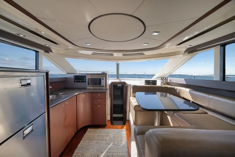  Yacht Photos Pics Luxurious interior of a 2012 Meridian 441 Sedan yacht with modern kitchen and seating area.