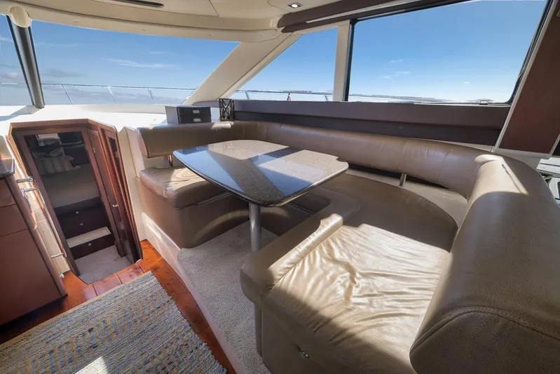  Yacht Photos Pics Luxurious interior of 2012 Meridian 441 Sedan yacht with leather seating and panoramic windows.