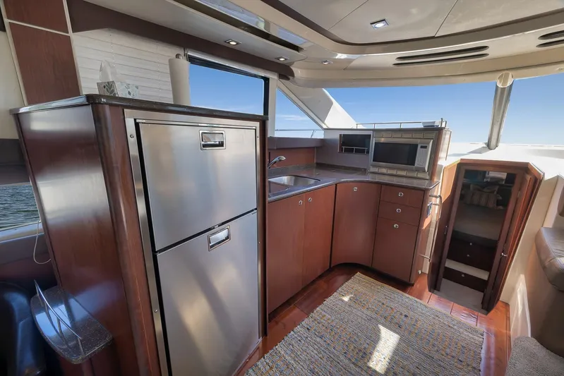  Yacht Photos Pics Interior of 2012 Meridian 441 Sedan yacht with modern kitchen and stainless steel appliances.