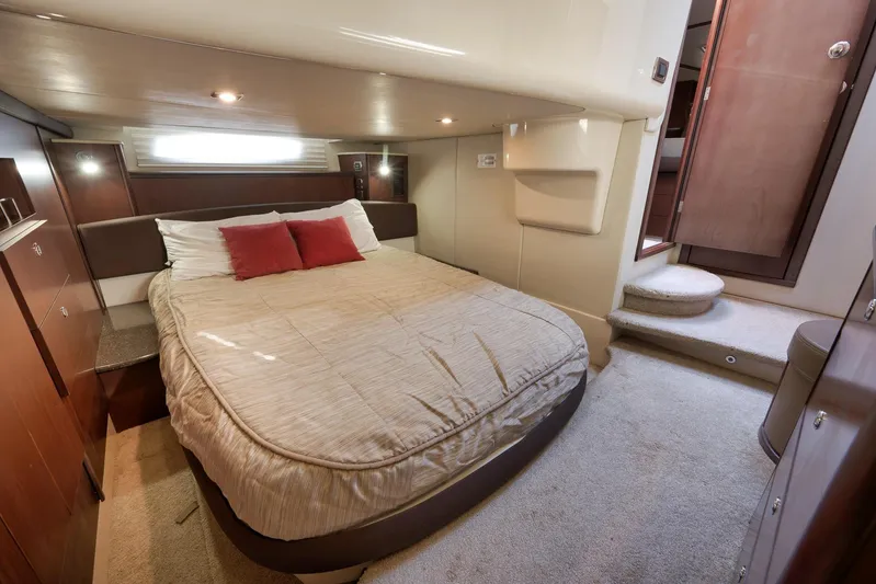  Yacht Photos Pics Luxurious bedroom interior of 2012 Meridian 441 Sedan yacht with cozy bedding.
