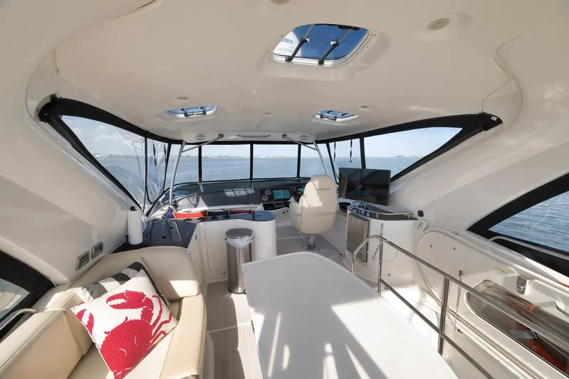  Yacht Photos Pics Luxurious interior of 2012 Meridian 441 Sedan yacht with panoramic windows and modern amenities.
