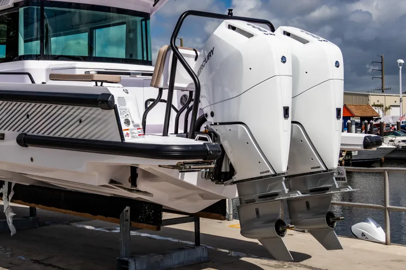  Yacht Photos Pics 2025 Axopar 37XC CROSS CABIN BRABUS Trim with dual outboard engines at dockside.