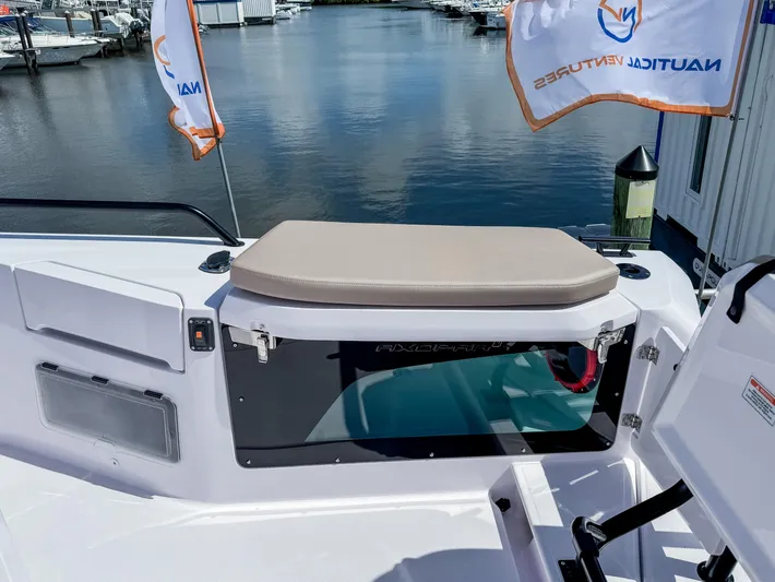  Yacht Photos Pics 2025 Axopar 37XC CROSS CABIN BRABUS Trim boat, docked with flags, rear seating view.