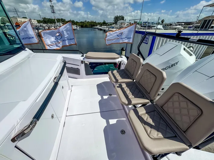  Yacht Photos Pics 2025 Axopar 37XC CROSS CABIN BRABUS Trim with luxurious seating and Mercury engines docked at marina.