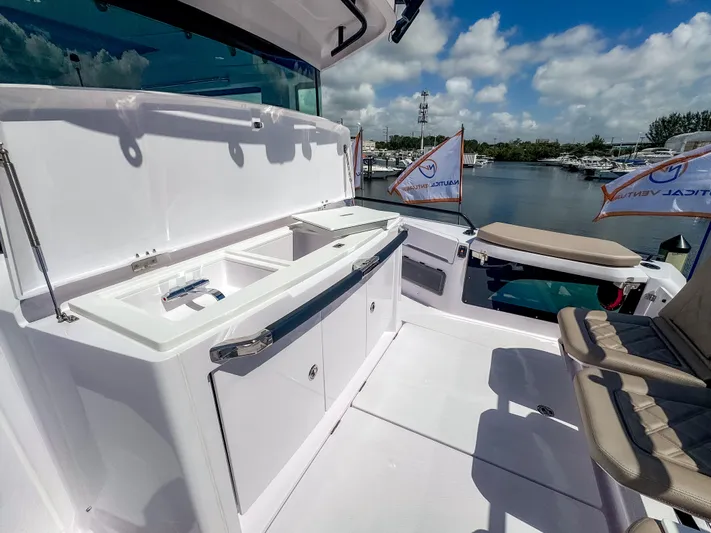  Yacht Photos Pics 2025 Axopar 37XC CROSS CABIN BRABUS Trim with sleek outdoor seating and storage.