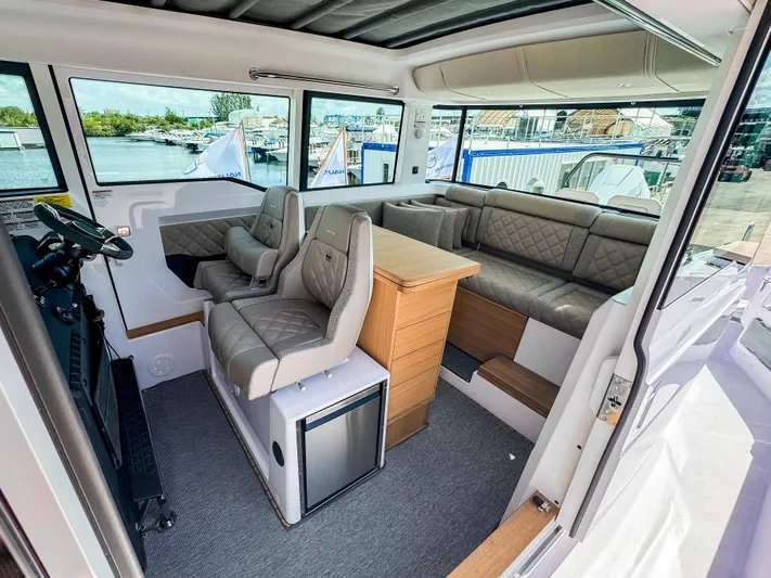  Yacht Photos Pics 2025 Axopar 37XC CROSS CABIN BRABUS Trim interior with luxurious seating and modern design.