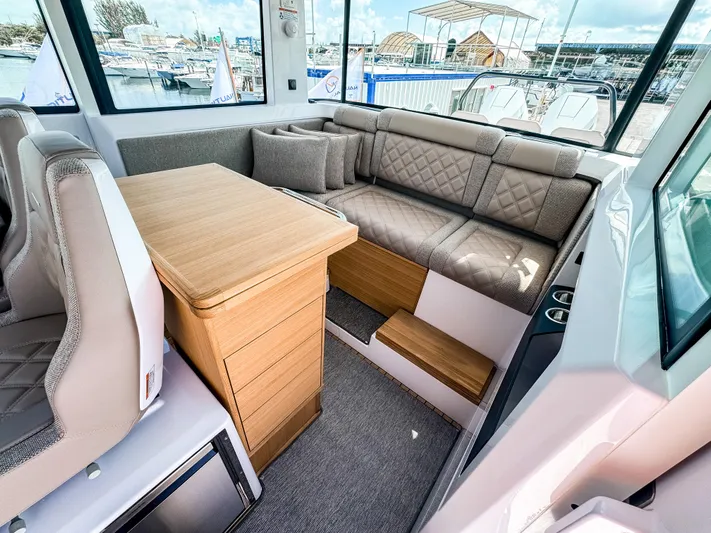  Yacht Photos Pics Luxurious interior of 2025 Axopar 37XC CROSS CABIN with Brabus trim, featuring plush seating.