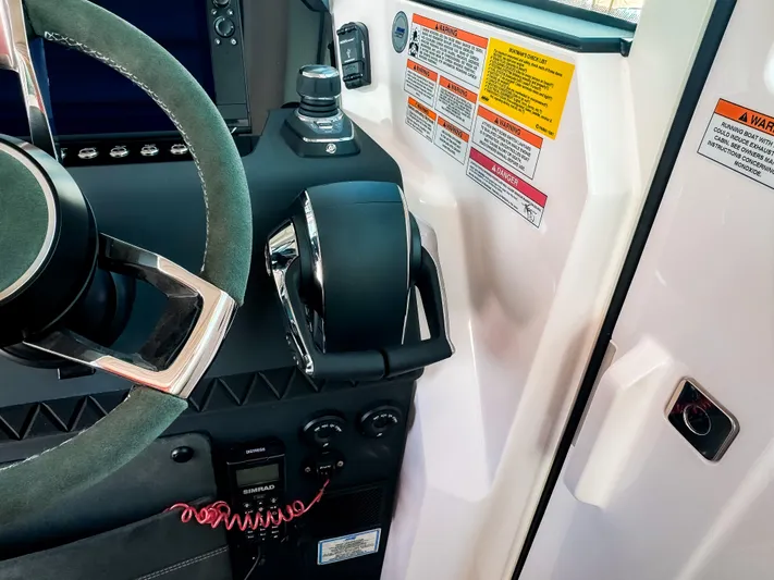  Yacht Photos Pics 2025 Axopar 37XC CROSS CABIN BRABUS Trim helm with steering wheel and control panel.