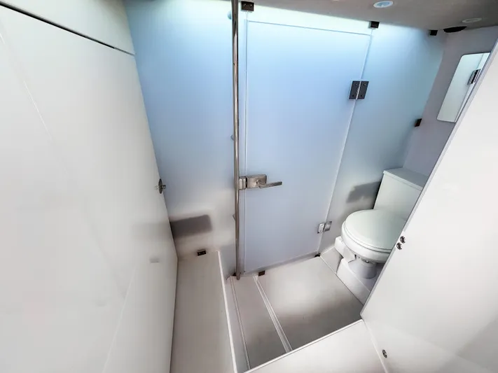  Yacht Photos Pics Modern bathroom in 2025 Axopar 37XC CROSS CABIN BRABUS Trim boat, featuring sleek design and amenities.