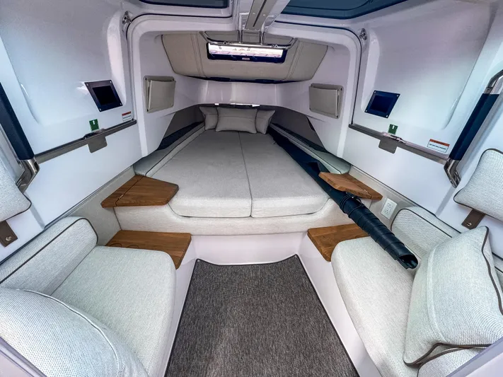  Yacht Photos Pics 2025 Axopar 37XC CROSS CABIN BRABUS Trim interior with modern seating and cozy sleeping area.