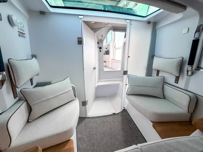  Yacht Photos Pics 2025 Axopar 37XC CROSS CABIN BRABUS Trim interior with modern seating and skylight.